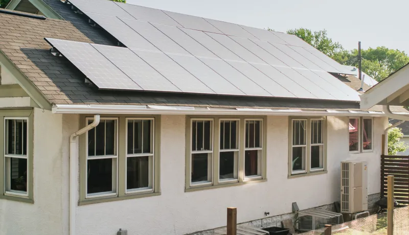 A home with solar panels on the roof.