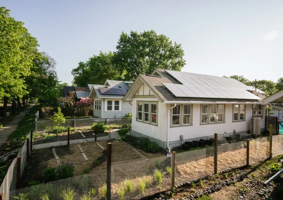 a house with a garden on a sunny day