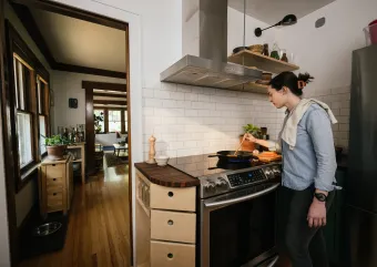 a person cooking in their home