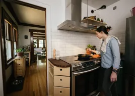 a person cooking in their home